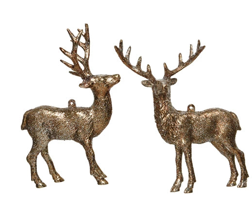 Two bronze deer figurines on a white background