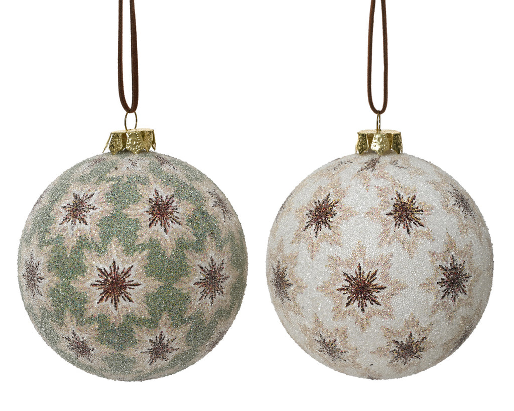 Two decorative Christmas balls with star patterns on a white background