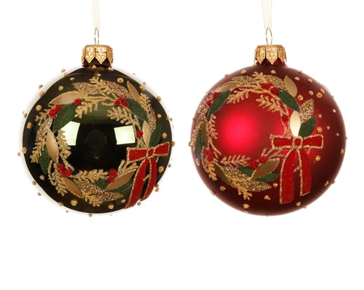 Two Christmas ornaments with wreath and bow designs on a white background