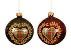 Two Christmas ornaments with plaid hearts and gold wreaths on a white background