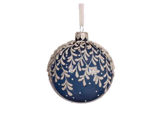 Decorative blue Christmas ball ornament with white floral pattern on a white background