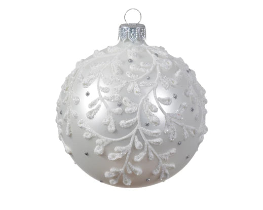 Decorative white Christmas ball ornament with intricate patterns on a white background