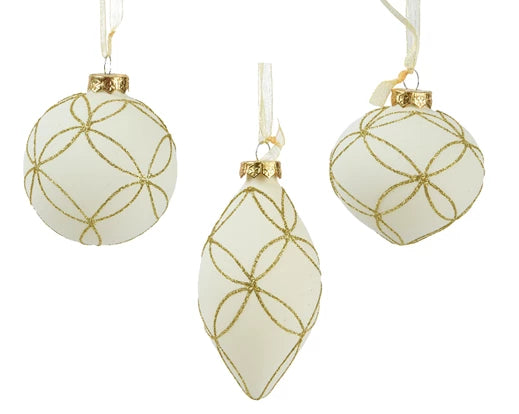 Three white Christmas ornaments with gold geometric patterns on a white background