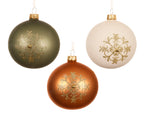 Three Christmas ornaments in green, gold, and white with gold snowflake designs on a white background.