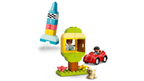 LEGO set with colorful rocket, treehouse, and car on a white background