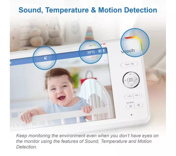 A white baby monitor camera with a screen showing a smiling baby, overlaid with feature callouts reading 'Sound, Temperature & Motion Detection' and explanatory text below.