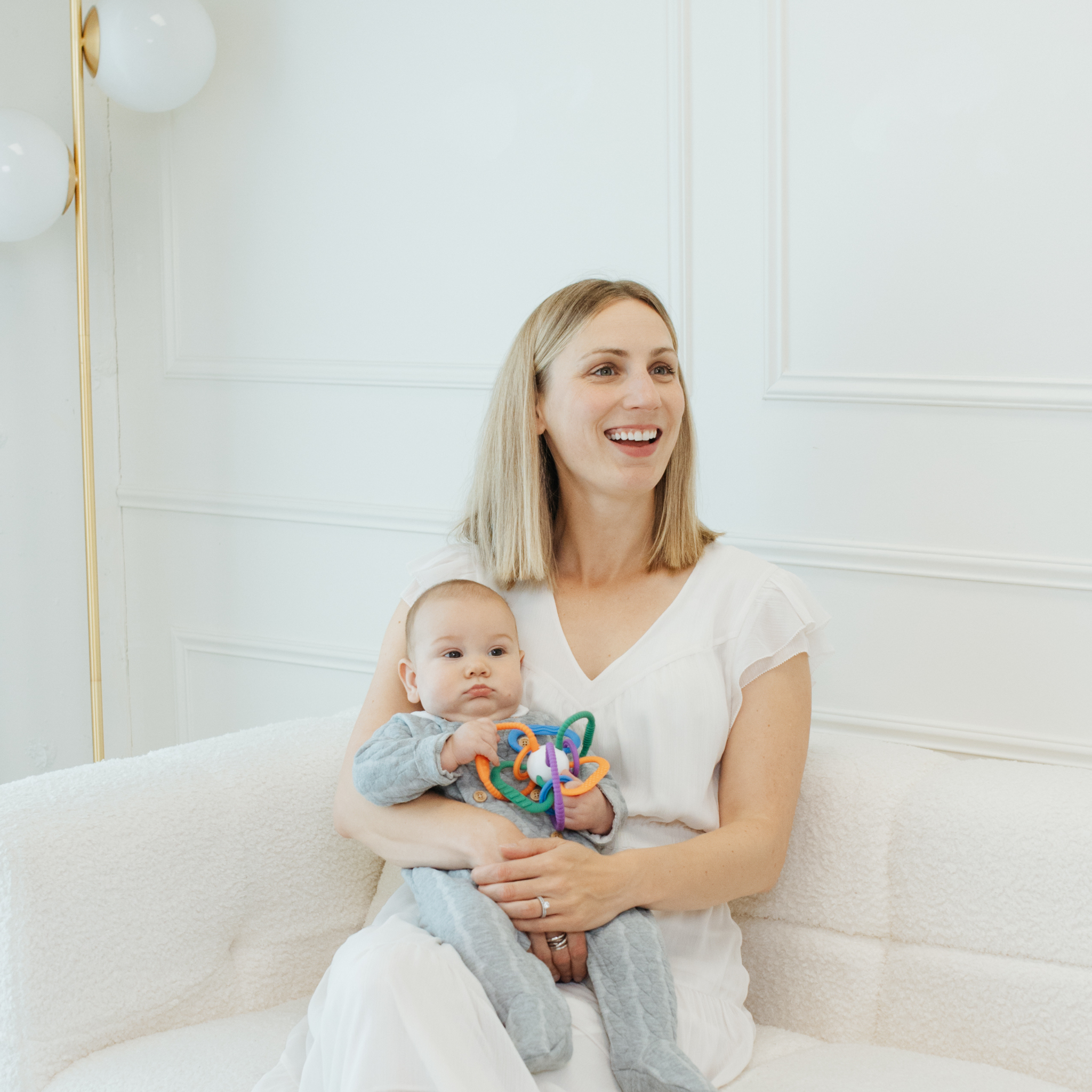 Baby holding Thiingy – Silicone Sensory Teething Ball for Fine Motor Skills