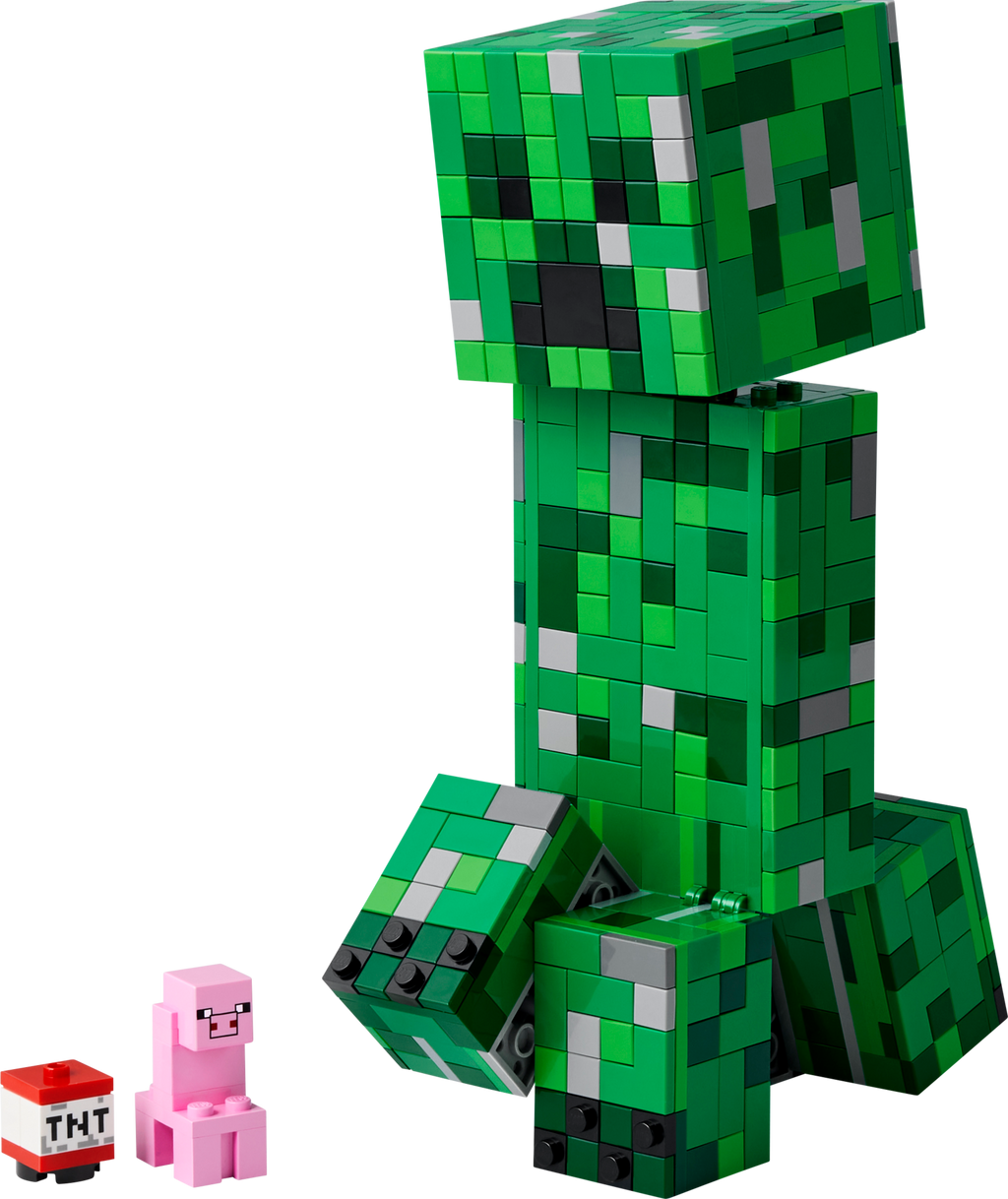Green Minecraft creeper figure made of interlocking bricks with a small pink pig and TNT block on a white background.