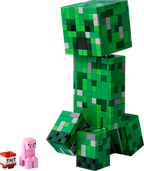 Green Minecraft creeper figure made of interlocking bricks with a small pink pig and TNT block on a white background.