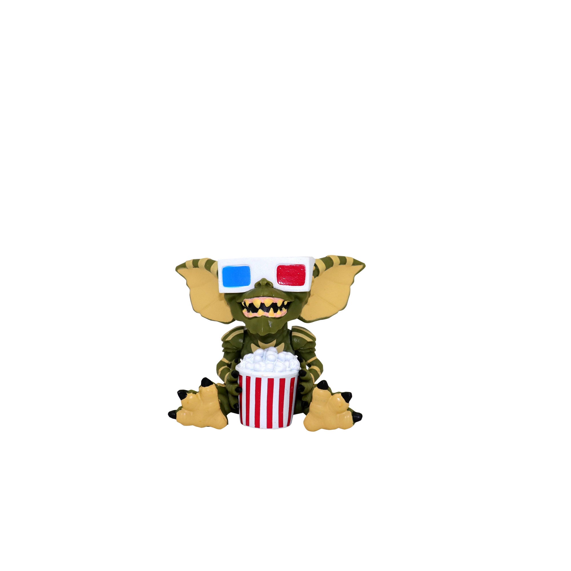 Toy figure of a creature with 3D glasses and popcorn bucket on a white background