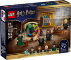 LEGO Harry Potter set packaging with characters and castle model on a wooden floor.