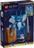 LEGO Harry Potter Wizard of Worms building set box, set number 76461, featuring a blue worm-like creature with wings, a brown clockwork chest, a glass beaker, and a wand, shown on a dark blue and gold background.