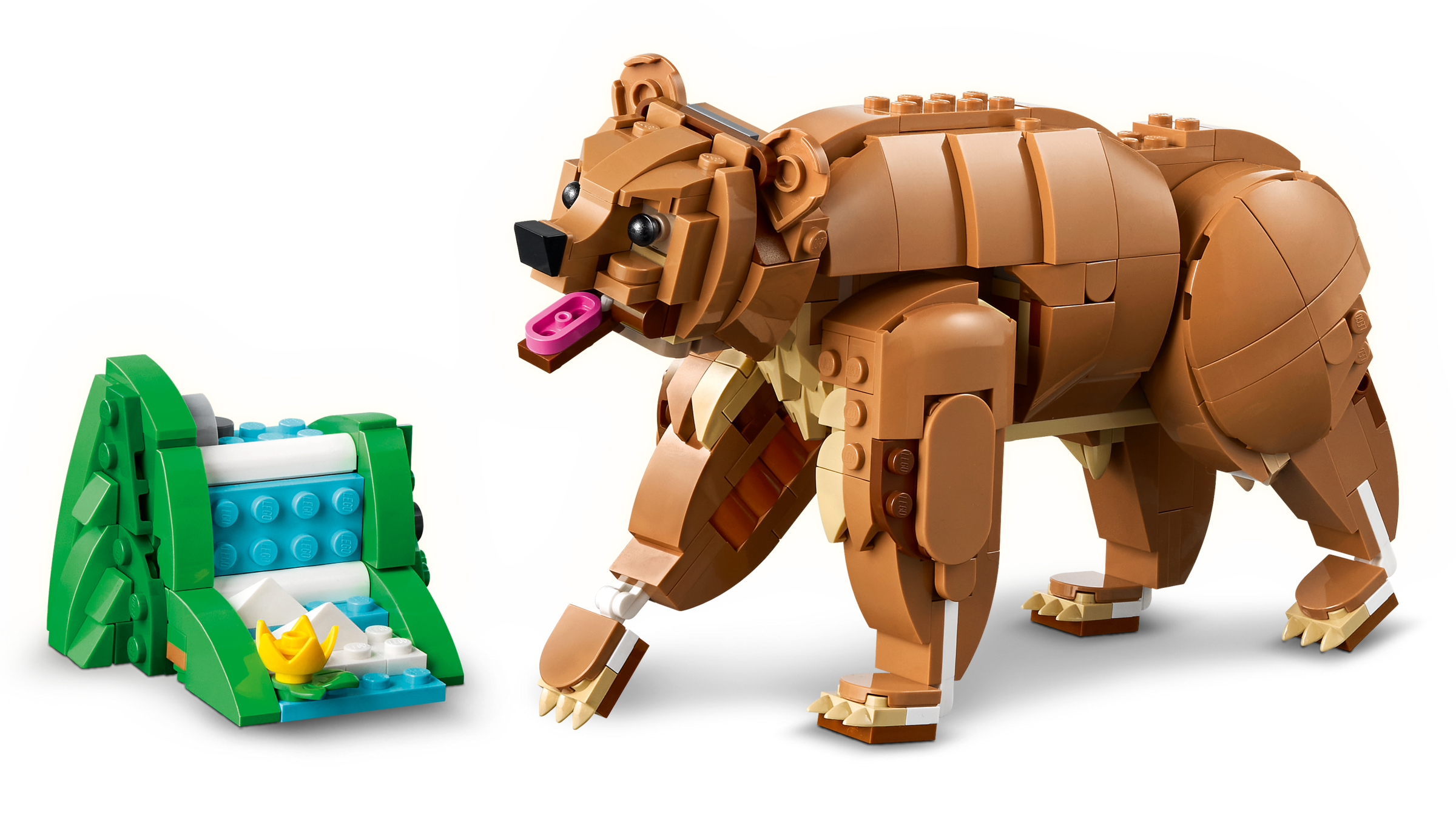 Toy bear and cave made of interlocking bricks on a white background
