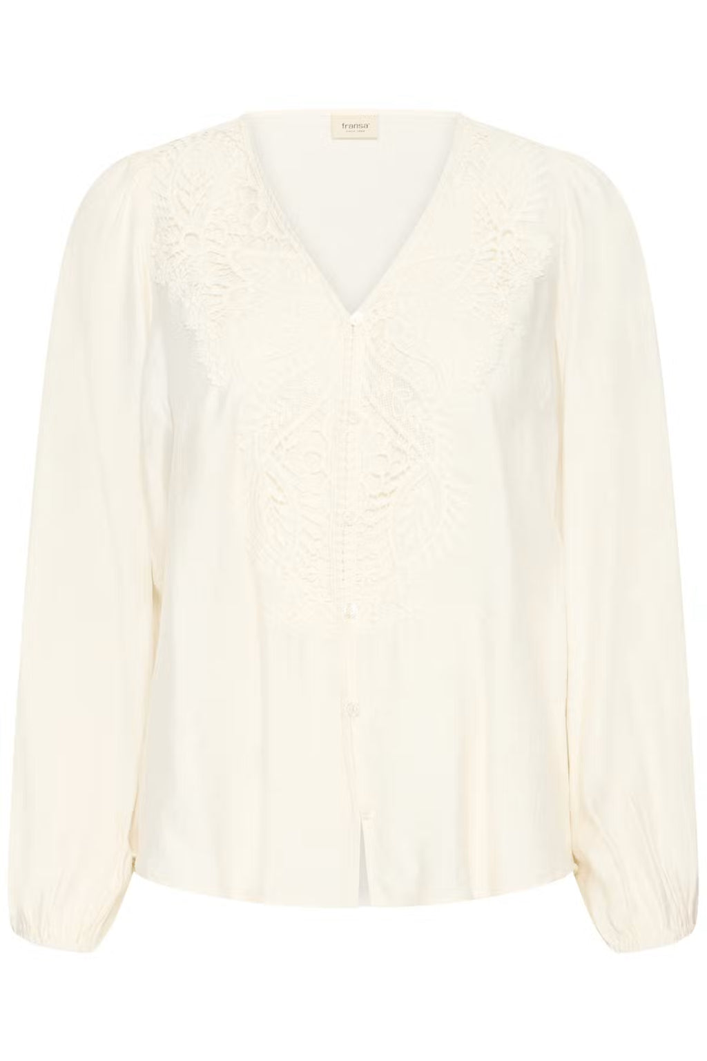 An Whisper White long-sleeve blouse with a V-neckline, featuring delicate lace embroidery across the chest and shoulders, displayed on a clean white background.