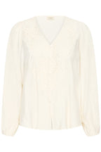 An Whisper White long-sleeve blouse with a V-neckline, featuring delicate lace embroidery across the chest and shoulders, displayed on a clean white background.