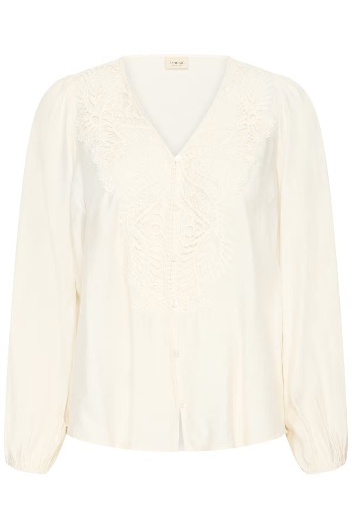 An Whisper White long-sleeve blouse with a V-neckline, featuring delicate lace embroidery across the chest and shoulders, displayed on a clean white background.
