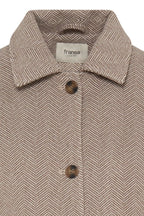 Close-up of a Fransa London herringbone patterned jacket in beige and brown, featuring a pointed collar and dark brown buttons.