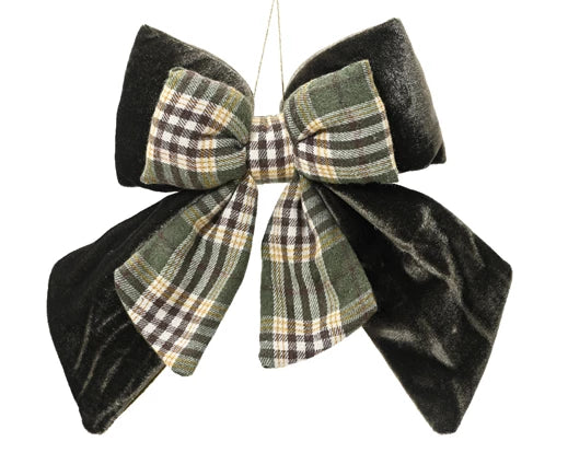 Close-up of velvet bow Christmas ornament with tartan fabric design