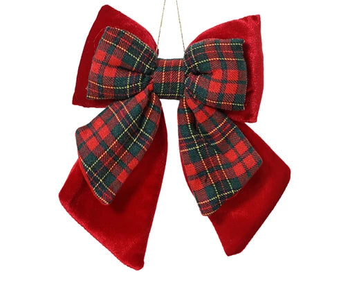 Close-up of velvet bow Christmas ornament with tartan fabric design