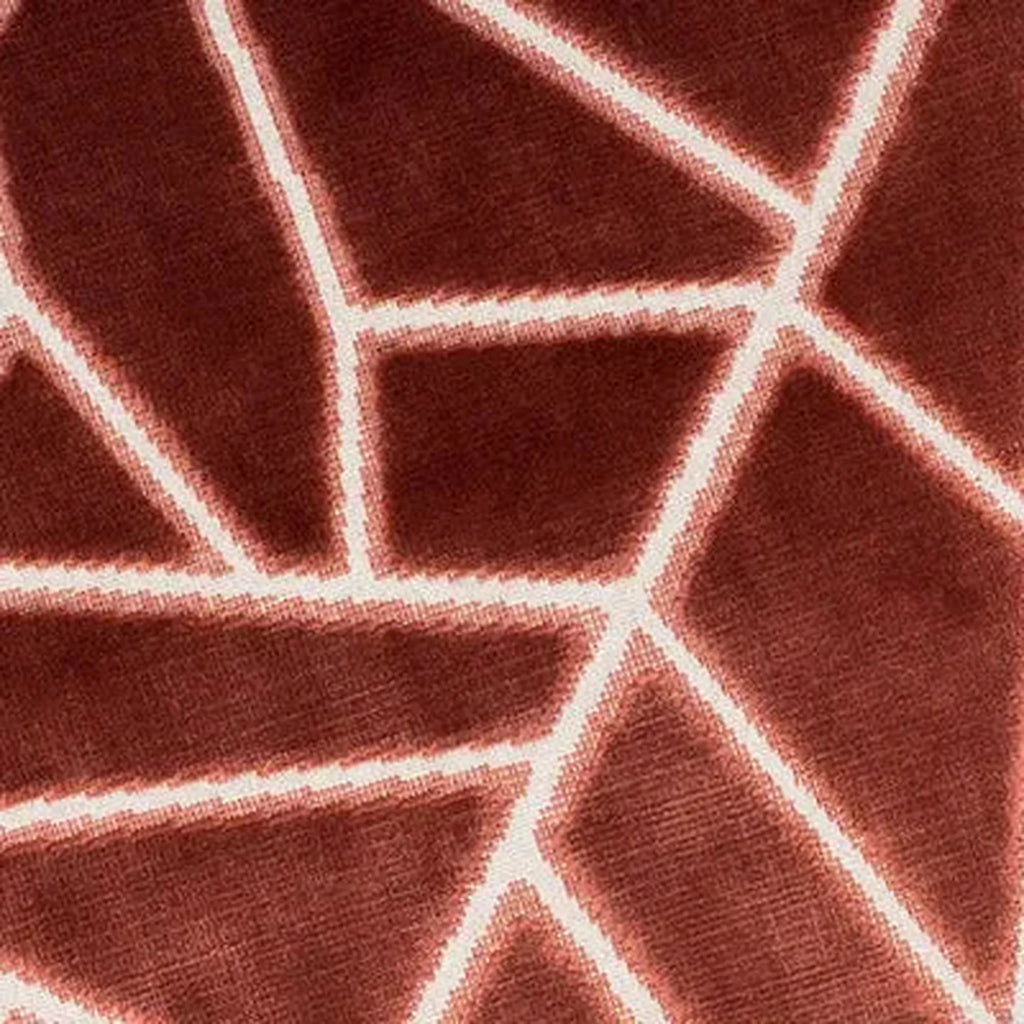 A close-up of Veda Cushion in Antique Rose textured fabric with a white geometric line pattern.