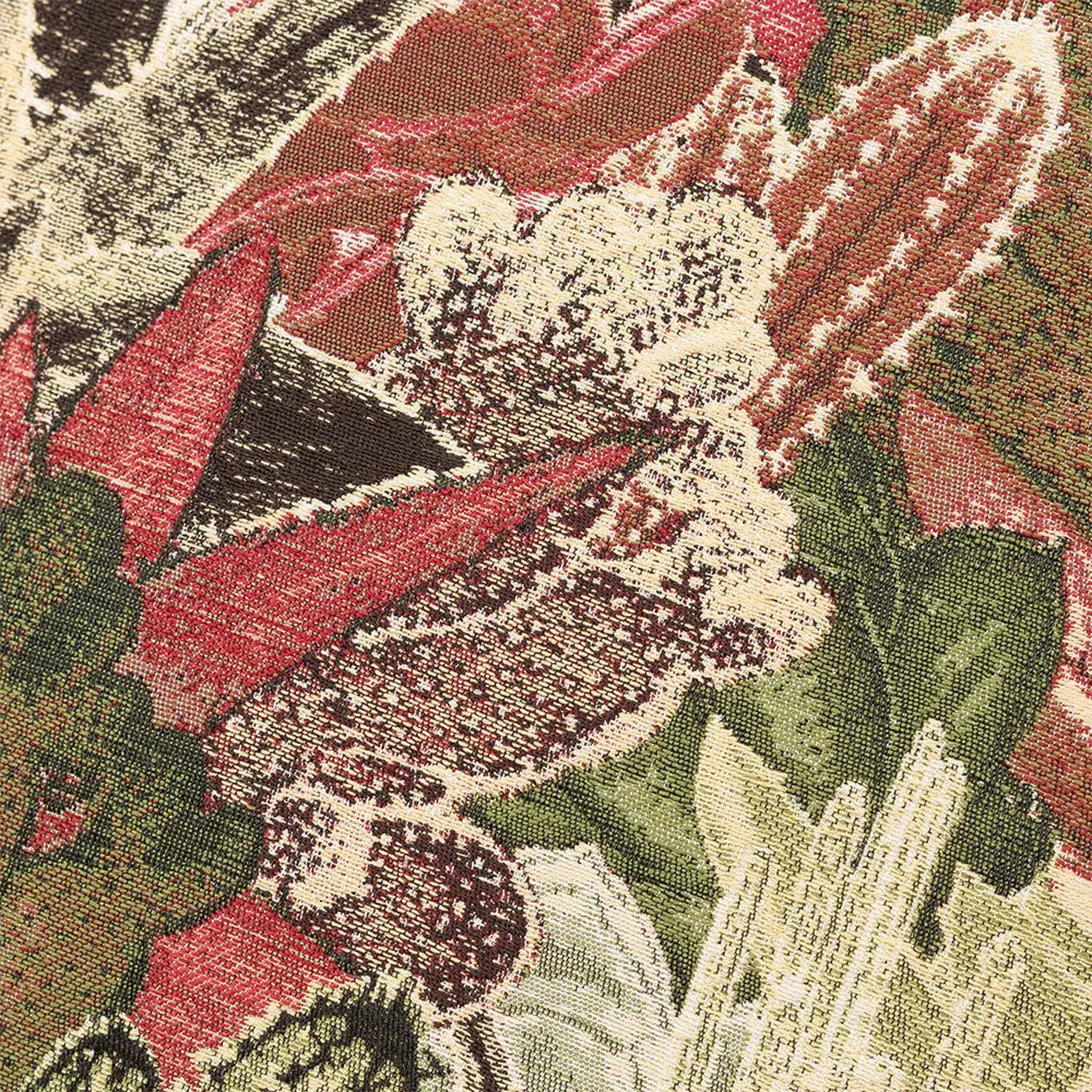 Close-up of a Merida Cushion in Green  floral pattern with red, green, and white colors.