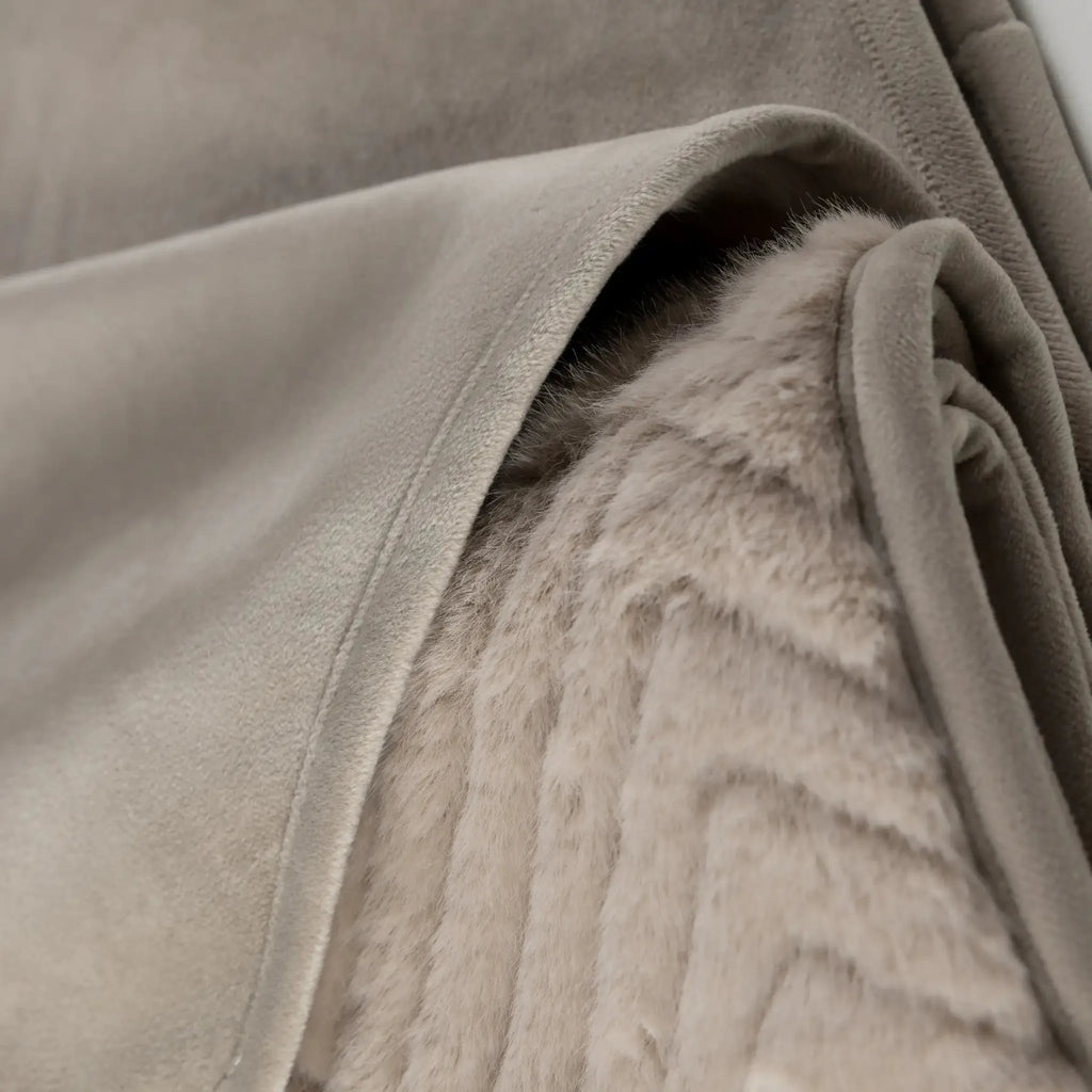 Close-up of a tEllis Throw in Mink - full view with a suede-like outer cover, showing the soft texture of the inner lining and folded edges.