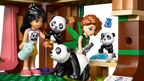 LEGO figures of two girls with panda toys in a playful setting