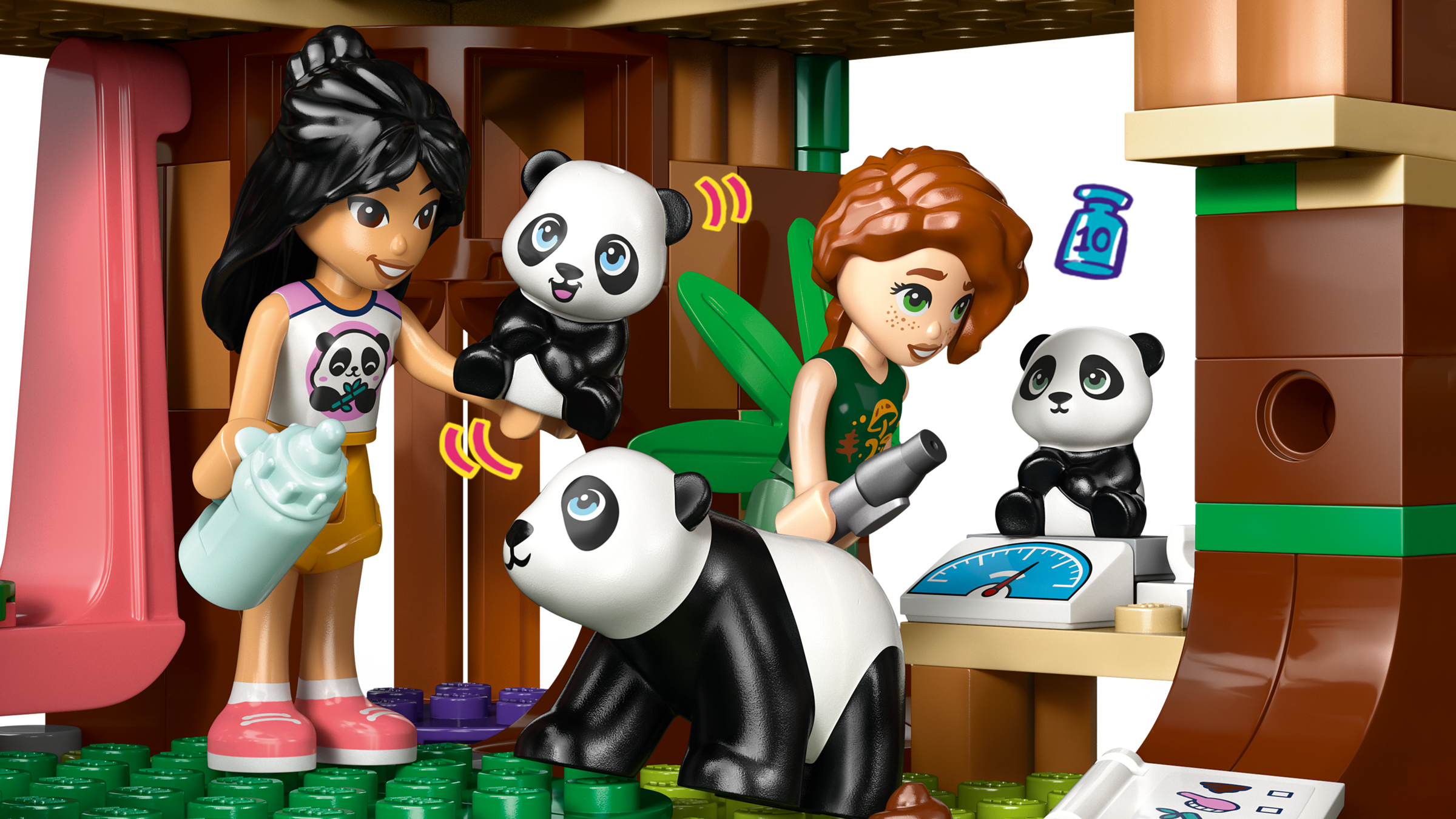 LEGO figures of two girls with panda toys in a playful setting