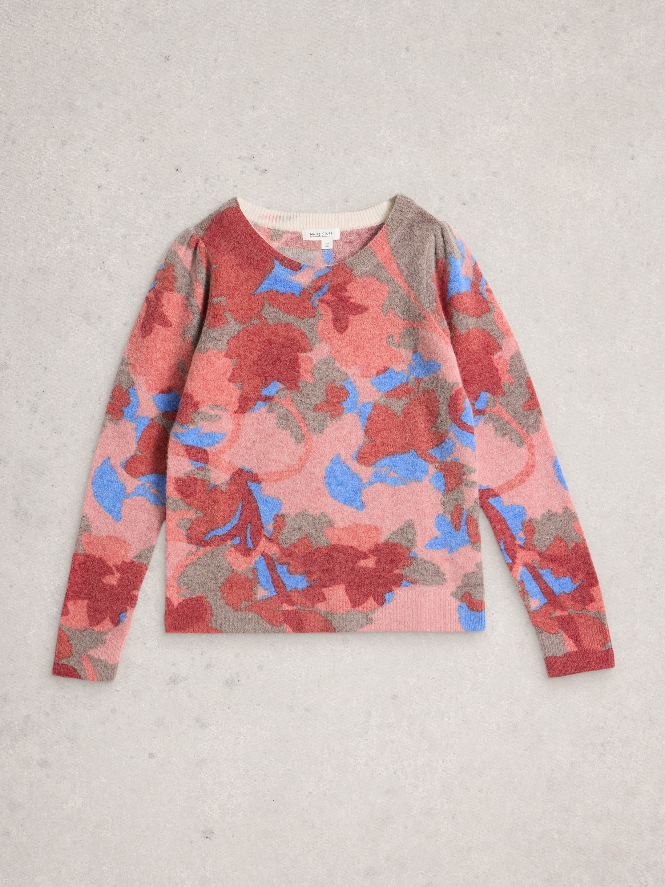 Floral patterned sweater on a light gray background