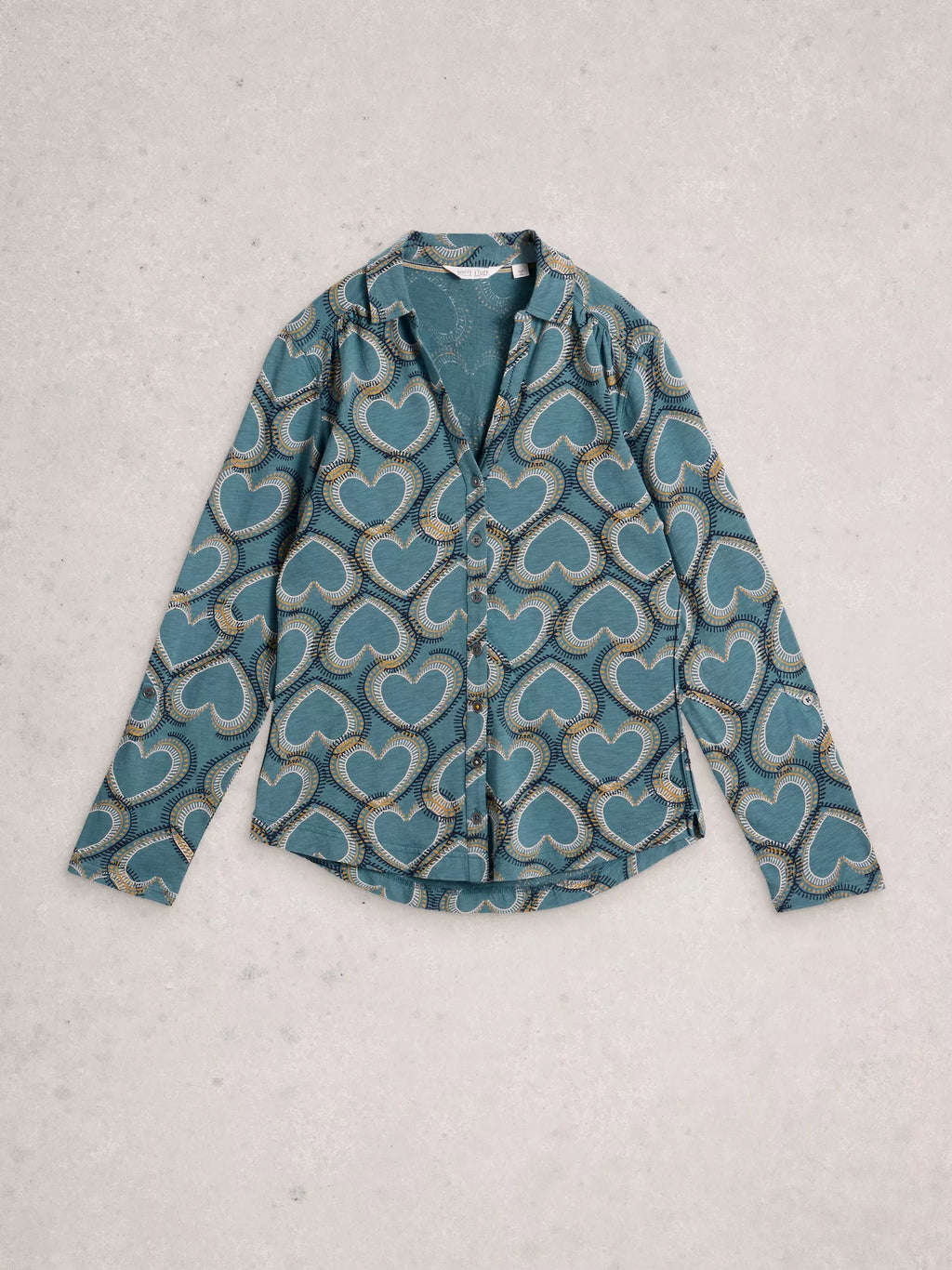 Blue patterned shirt on a light gray background