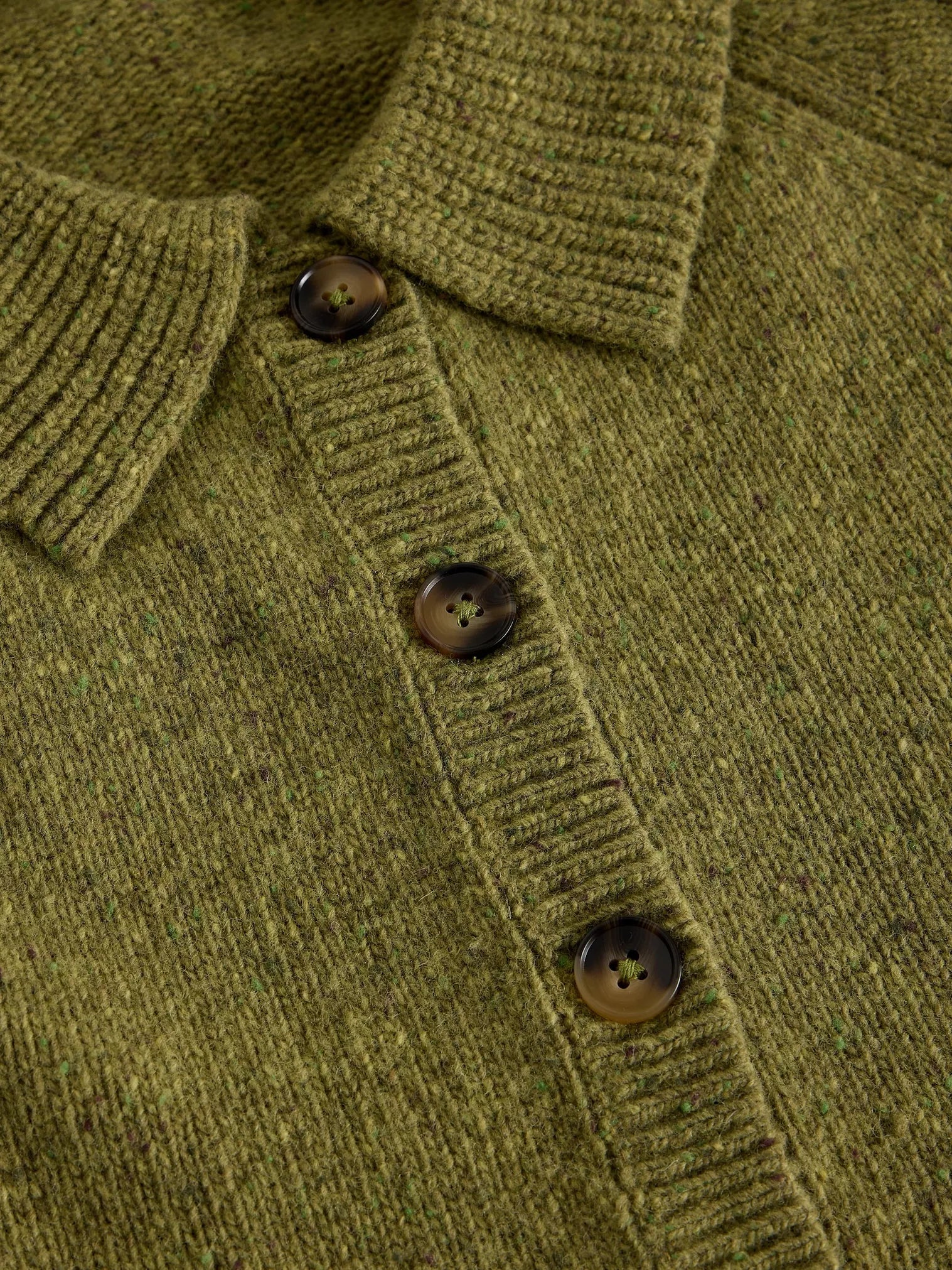 Close-up of an Shepherd Collar Cardi – Mid Chartreuse  dark brown buttons and ribbed collar, placket, and cuffs.