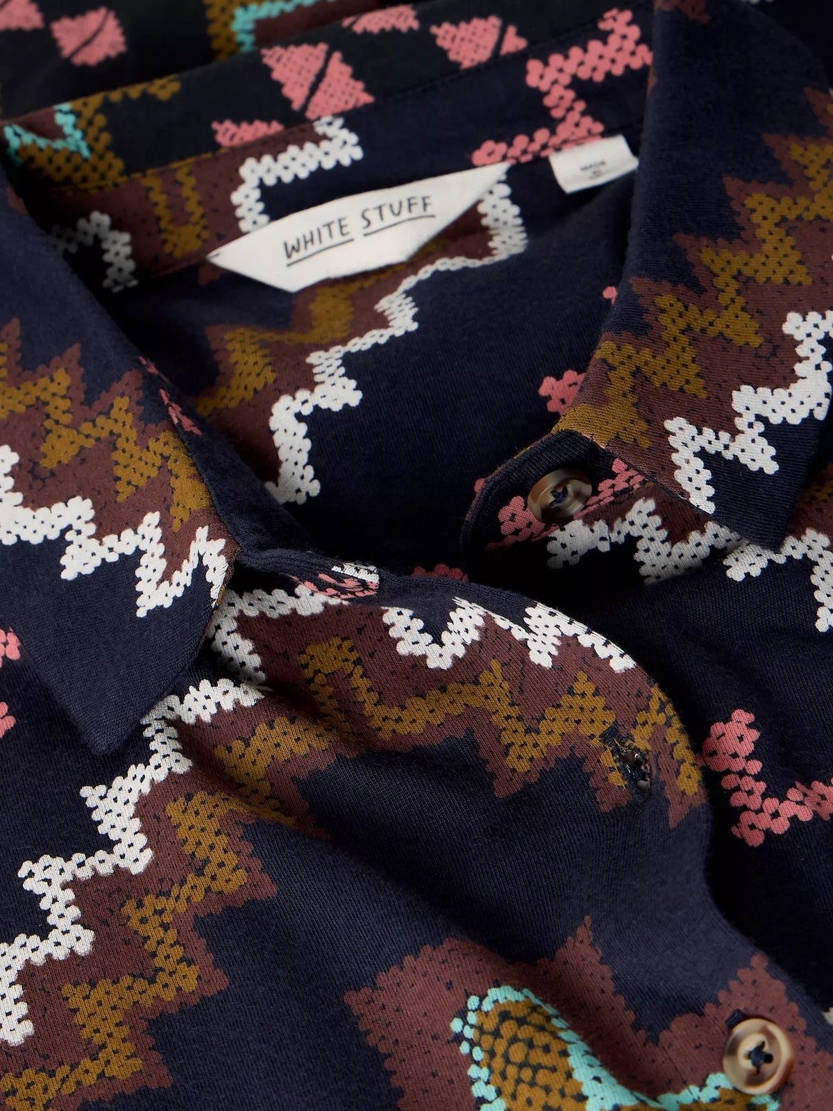 Patterned fabric with a brand label visible