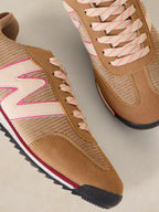 A pair of A Lucy Trainer sneaker in Natural multi  in tan suede and textured knit, featuring cream overlays with pink trim, pink-and-beige laces, and a black and red sole.