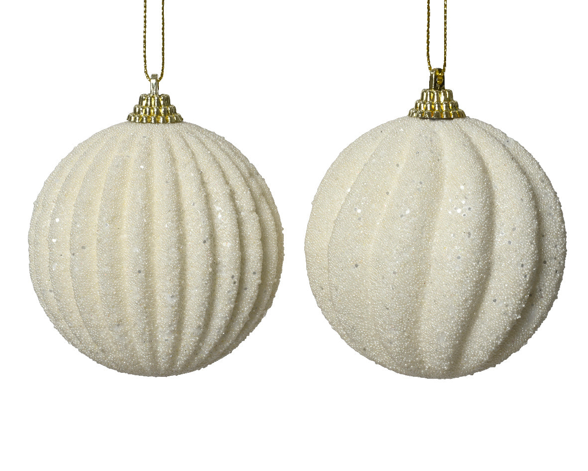 Two beige textured Christmas balls with gold hanging chains on a white background