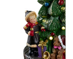 Christmas-themed figurine with a child and teddy bear near a decorated tree on a white background