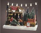 Decorative  Lumeino Christmas scene with a tree stand, trees, and people on a brown background - 481434
