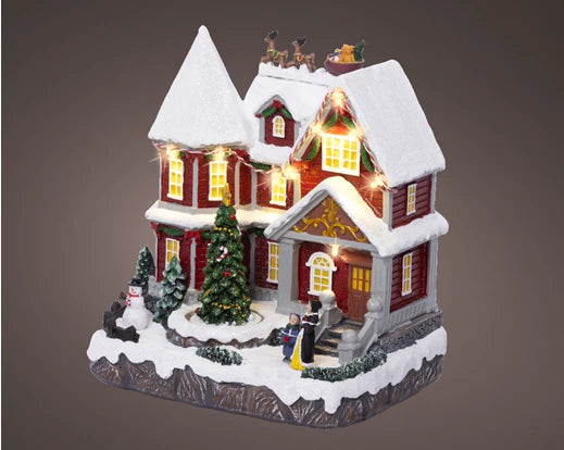 Lumineo LED Christmas village scene with music, movement, and warm white lights – 23.5 cm indoor decoration, battery powered