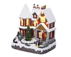Lumineo LED Christmas village scene with music, movement, and warm white lights – 23.5 cm indoor decoration, battery powered