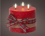 Rustic red LED candle with check bow and warm white flame effect, 15cm