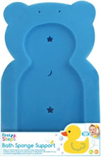 A blue bear-shaped bath sponge support stand with star and crescent moon cutouts, shown with a First Steps bath sponge and a yellow rubber duck on a white background with product packaging text at the bottom.