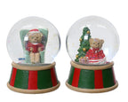 Two Christmas-themed snow globes with teddy bears and trees on a white background