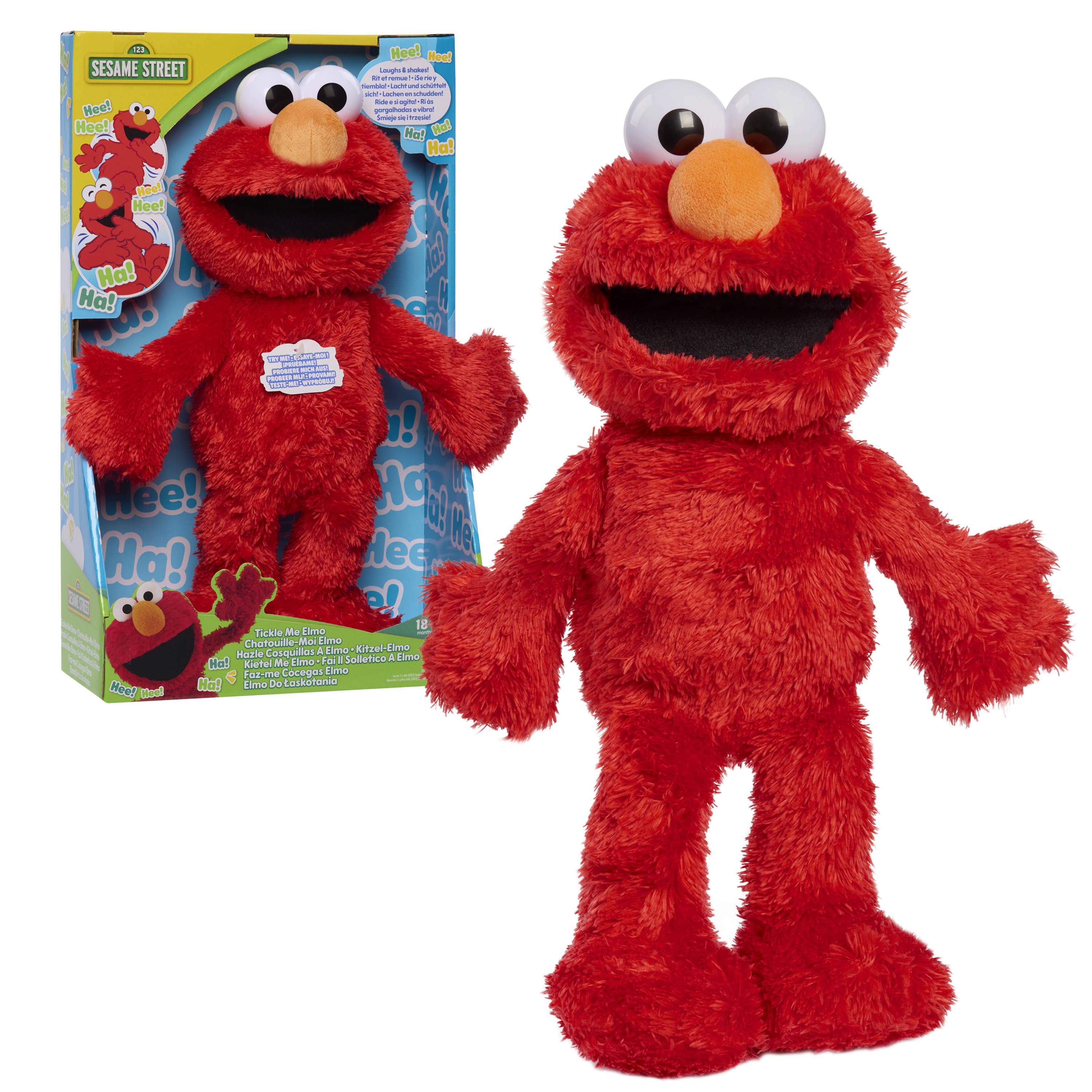 Red plush toy resembling a well-known character from Sesame Street, next to its packaging.