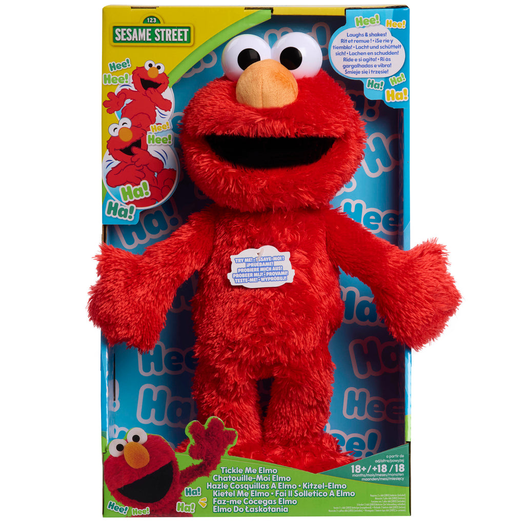 Red Sesame Street Elmo plush toy in packaging