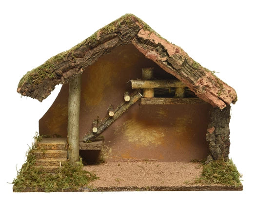 Wooden nativity house with ladder and natural moss and bark detail.