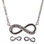 A rose gold infinity necklace with a chain and earrings featuring a similar design, adorned with sparkling stones.