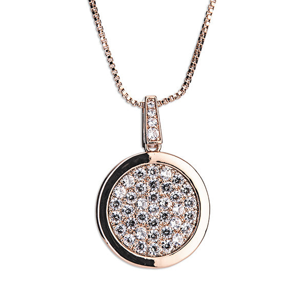 A rose gold diamante round pendant with a chain, the pendant features a central diamond surrounded by smaller diamonds set in a circular pattern.