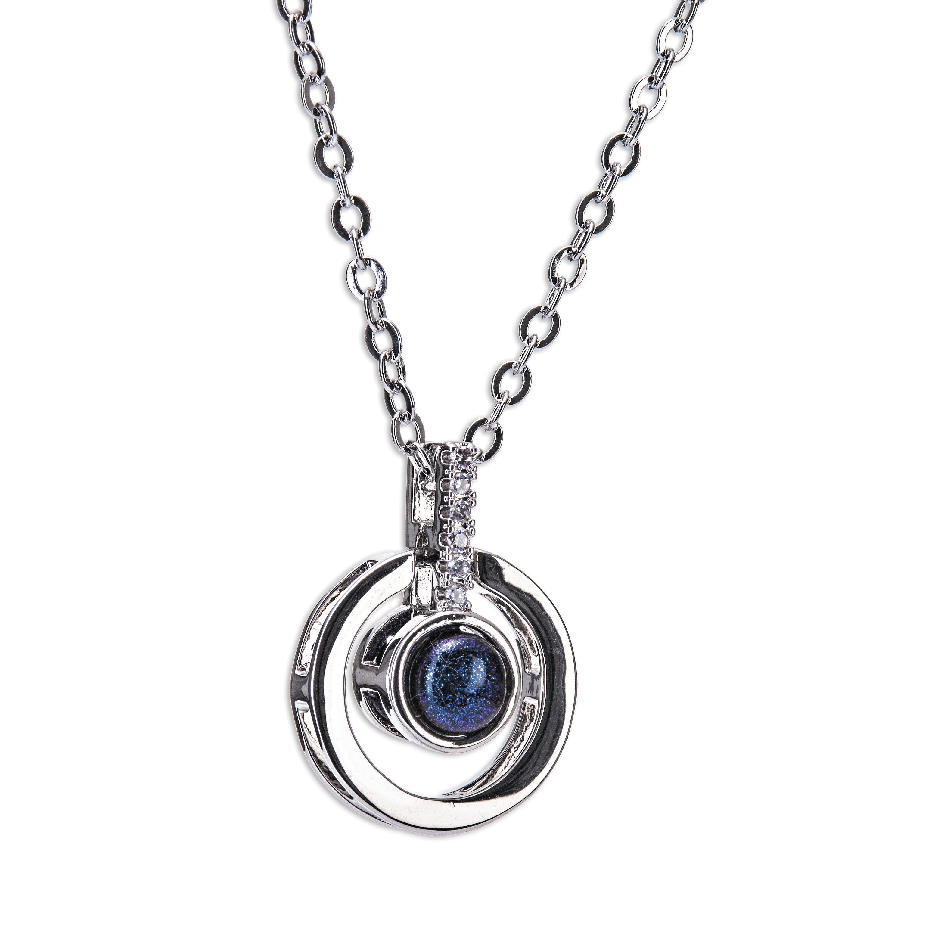 A silver necklace featuring a large blue stone pendant and smaller pendants along the chain, presented against a white background.