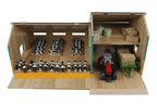 Model farm with animals and a tractor inside a wooden shed