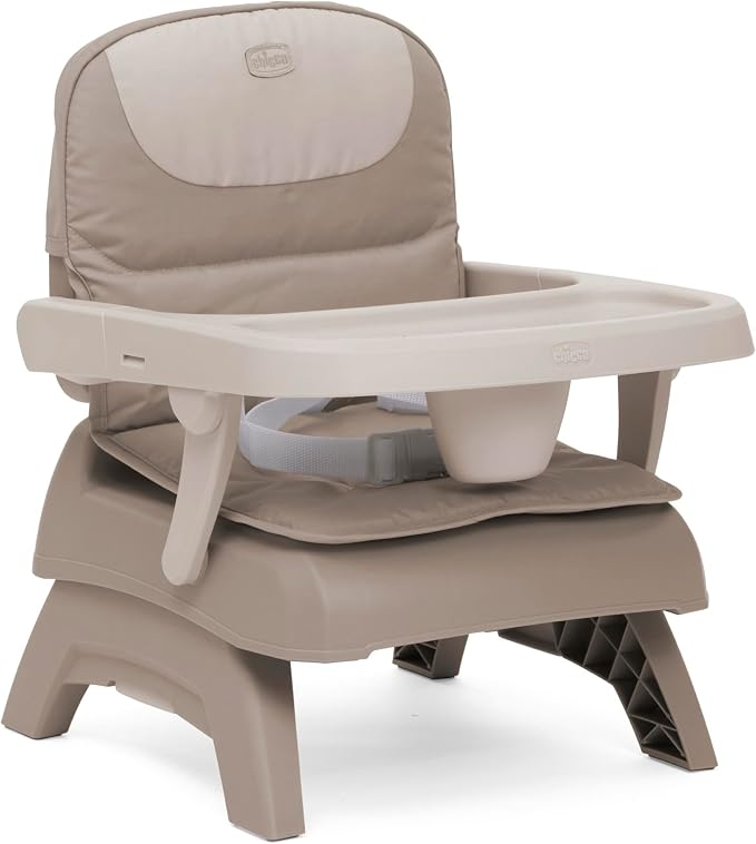 A beige and taupe baby high chair with an integrated tray, padded seat cushion, and adjustable support base, shown on a clean white background.
