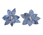 Two blue decorative flowers on a white background